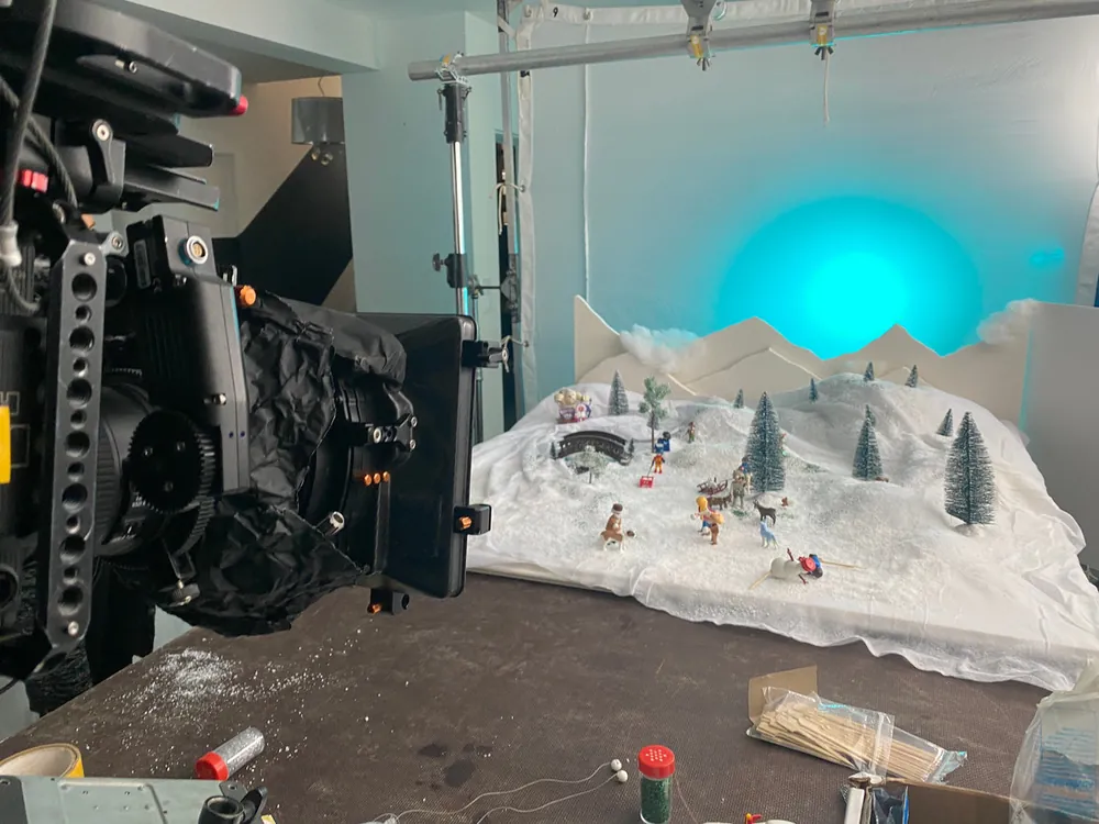 Miniature winter village set on the camera cart