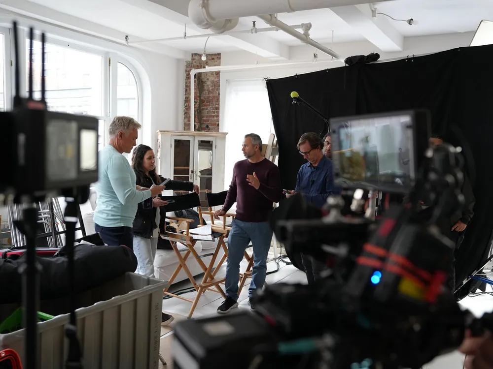 Crew setting up in a bright apartment location