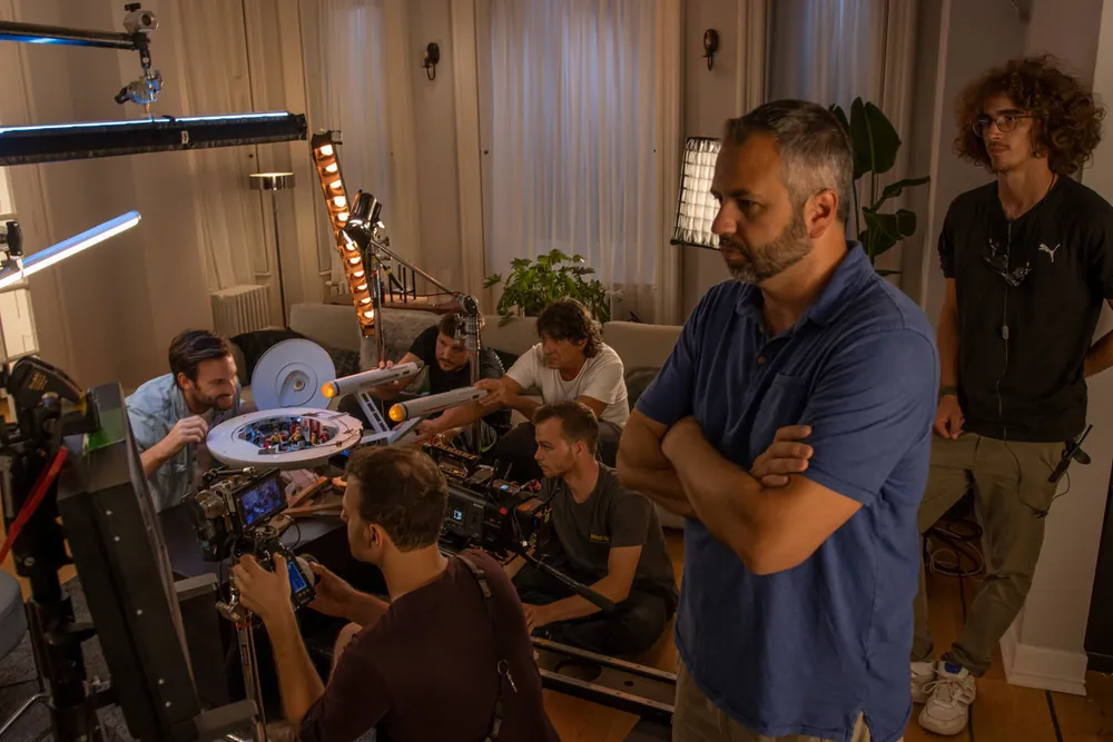 Crew around the monitor on set